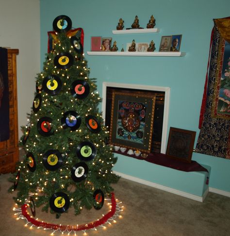 Rock and roll christmas tree meets Buddhist shrine vintage 45 records Record Christmas Tree, Rock Music Themed Christmas Tree, Rock And Roll Christmas Decorations, Rockin Around The Christmas Tree Theme, Rock N Roll Christmas Tree, Rocking Around The Christmas Tree Theme, Musical Christmas Tree, Record Garland, Rh Christmas