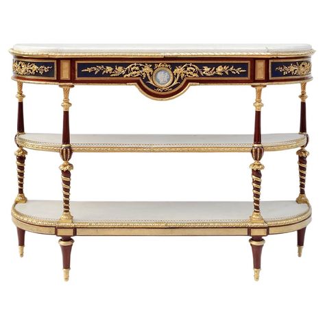 Louis XVI style console sideboard in mahogany with three flattened half-moon shaped superposed trays and a straight apron with a curved central notch. It stands on four high spinning top legs, topped by composed shaped uprights: inversed twisted and gilt balusters and fluted balusters. Rich chiselled and gilt bronze ornamentation such as notched plates, friezes of eggs and water leaves and an openwork hearts frieze balcony on the inferior tray, water leaves and grapes on uprights, laurel leaves Traditional Console Tables, Louis Xvi Furniture, Luxury Sofa Living Room, Bronze Decor, Console Table Styling, Living Room Decor Inspiration, Sideboard Console, Louis Xvi Style, French Furniture