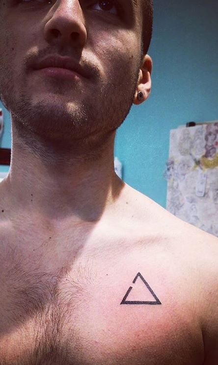 Chest tattoos for men are very popular nowadays. #tattoos Men’s Simple Chest Tattoos, Triangle Chest Tattoo, Small Center Chest Tattoo, Simple Chest Tattoo Men, Chest Piece Tattoo Men Design, Small Chest Tattoo Men, Small Tattoo Ideas For Men, Chest Tattoos For Men, Under Chest Tattoo