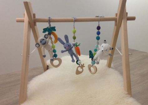 Wooden baby gym with 3 crochet toys: a white monkey, an arctic fox, a grey rabbit by LanaCrocheting on Etsy https://www.etsy.com/listing/492462178/wooden-baby-gym-with-3-crochet-toys-a Teddy Bear Nursery Decor, Baby Hanging Toys, Etsy Nursery, Baby Staff, Wood Baby Toys, Teddy Bear Nursery, Wooden Baby Gym, Baby Gym Toys, Baby Play Gym