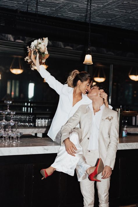 Wedding Couple Popping Champagne, Cityscape Wedding Photos, City Hall Wedding Philadelphia, Flash Photo Engagement Shoot, Christmas Courthouse Wedding, Courthouse Elopement Ideas, Bar Wedding Pictures, Boss Couple Photoshoot, Wedding Bar Photoshoot