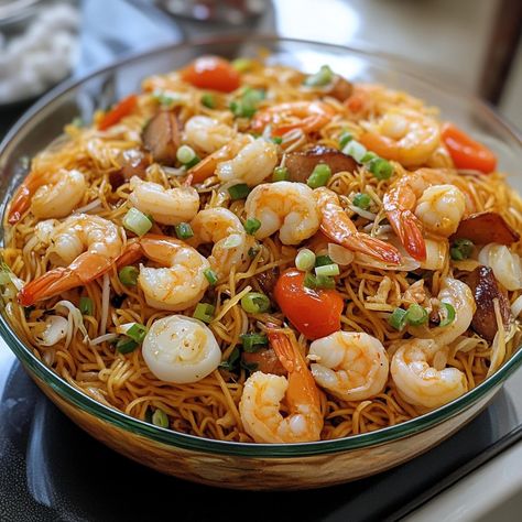 🍜🎉 Dive into Pancit Malabon Fiesta—a rich, savory noodle dish with seafood and a flavorful sauce. A true Filipino celebration! 🎉🍜 #PancitMalabon #FilipinoFeast Pancit Malabon Fiesta Ingredients: Pancit malabon noodles (1 package, 12 oz) Shrimp, peeled (1/2 lb) Squid, sliced (1/2 lb) Fish sauce (2 tbsp) Annatto powder (1 tbsp) Garlic, minced (4 cloves) Onion, chopped (1) Tomatoes, chopped (2) Shrimp broth (2 cups) Pork belly, diced (1/2 lb) Cooking oil (2 tbsp) Instructions: Heat oil in a ... Filipino Fish Recipes, Pancit Recipe Filipino, Pancit Guisado, Pancit Malabon, Shrimp Broth, Pancit Recipe, Instagram Recipes, Noodle Dish, Trending Recipes