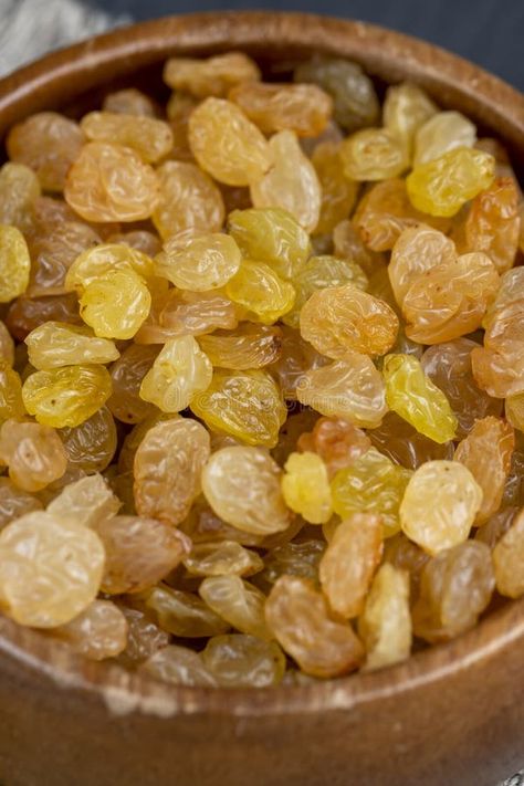 Dried yellow grapes without seeds raisins royalty free stock photography Golden Raisins, Stock Photography Free, Wooden Table, Raisin, Stock Photography, Grapes, Seeds, Royalty, Royalty Free