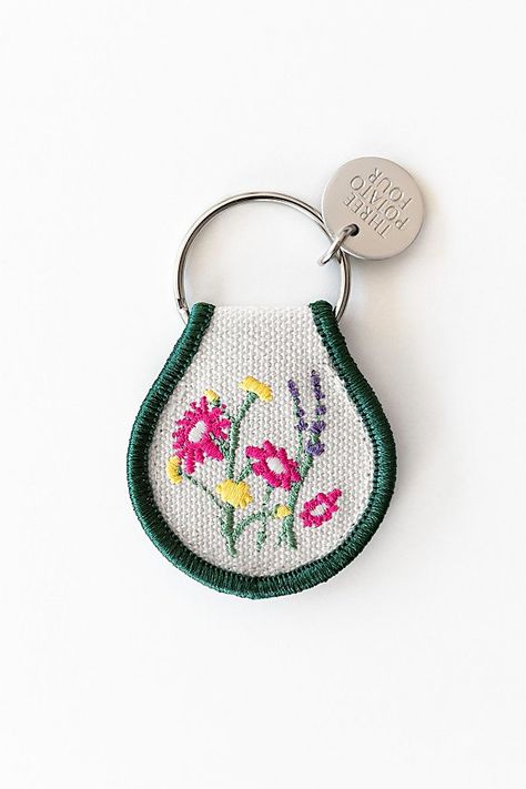 This petite, florally embroidered patch keychain is the quintessential accessory to hook onto your keys, tote bag, or luggage.**Care/Import*** Made In China**Contents*** 100% Cotton**Dimensions*** Measures 2.5 inches x 1.5 inches Chains Aesthetic, Four Patch, Stationary School, Oversized Tote Bag, Metallic Bag, Wristlet Keychain, Car Keychain, Quilted Bag, Coin Pouch