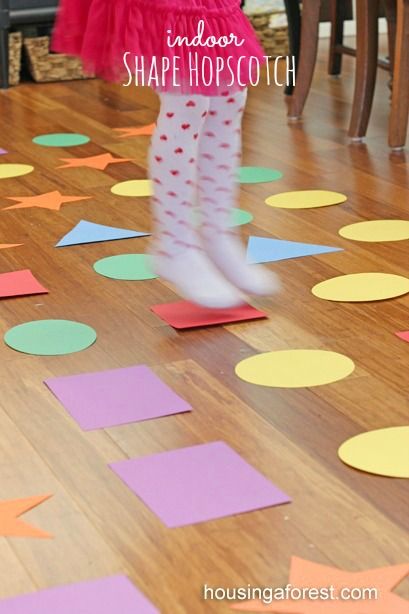 Indoor Games for kids ~ Shape Hopscotch is a fun Gross motor game Teaching Shapes, Shape Games, Indoor Games For Kids, Shapes Preschool, Gross Motor Activities, Shapes Activities, Games For Toddlers, Preschool Games, Indoor Games