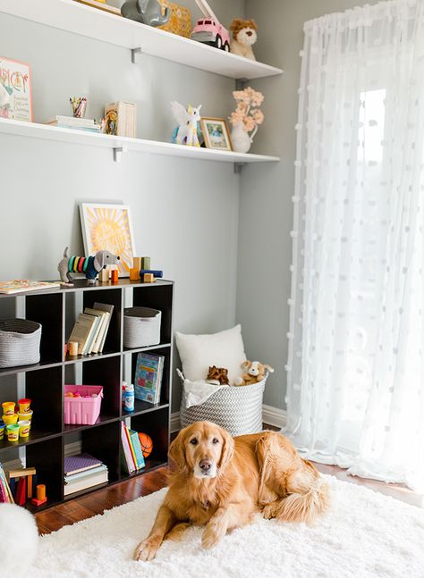 Leila, from Inspired By This, shows you how to transform your nursery into this gender-neutral kid’s playroom with the help of BEHR Paint in this DIY makeover. Leila used the light gray hue of Quiet Time, from the BEHR 2018 Color Trends, to create an open and airy feel in the interior design of her home. A bright white fur rug adds a cozy feel while open shelving provides plenty of storage. Click here to see the before and after pictures. Playroom Paint Colors, Kids Room Paint Colors, Playroom Paint, Neutral Playroom, Gender Neutral Kids Room, Playroom Makeover, Ikea Kids Room, Neutral Kids Room, Vintage Kids Room