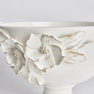 Each and every dogwood flower and leaf detail of the Fiori decorative bowl is handmade, and hand-applied by Italian artisans in Tuscany, Italy. A seamless design in a soft white glaze and delicate antiquing along petal edges. With classic Italian craftsmanship passed down through generations, each piece is a true original. On a grand scale, it is a dynamic centerpiece for a feature table, kitchen island, or mantel. Napa Home and Garden Fiori Decorative Footed Bowl - Decorative Plates & Bowls in Napa Home, Ceramics Pottery Bowls, Table Kitchen Island, Dogwood Flower, Diy Raised Garden, Air Dry Clay Projects, Pottery Handbuilding, Dogwood Flowers, Clay Crafts Air Dry