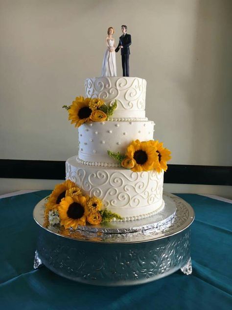 Sunflower Wedding Cake at Vics on the River in Savannah, GA - Cake by Baker's Pride, Flowers provided by Kato Floral Design, and Cake Topper by Wedding Collectibles - Sunflower Wedding #beaudoinbash #Savannah #wedding #savannahwedding #sunflowerwedding #sunflower #sunflowerweddingcake #bride #katofloraldesign #bakerspride #bakersprideofsavannah #vicsontheriver #weddingcollectibles Sunflowers Wedding Cake, 2 Tier Sunflower Wedding Cake, Sunflower Cake Wedding, Fall Sunflower Wedding Cake, Wedding Cake Sunflower And Roses, Wedding Cake No Fondant, Sunflower Rose Wedding Cake, Rustic Sunflower Wedding Cake, Sunflower Wedding Cakes