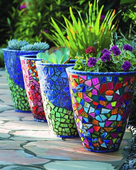 Lady upcycles tired planters. Her new display is stunningly vibrant. Mosaic Tile Planters Diy, Pottery Flower Pots Ideas, Plant Pot Mosaic, Mosaic Flower Pots Diy Ideas, Mosaic Clay Pots, Mosaic Planters Flower Pots, Upcycle Planters Diy Projects, Diy Tile Projects Crafts, Mosaic Garden Art Diy