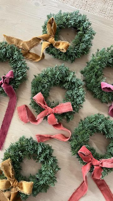 Amanda // Party + Home 🤍 on Instagram: "I found the DREAMIEST velvet ribbon at hobby lobby & had to use it on these cutie mini wreaths (also from hobby lobby)! 🎄 you can tie it on the wreath or use hot glue (like I did). Mini wreaths are one of my very favorite Christmas decorations! I put them on the backs of our dining chairs & hang them up all over the house! ✨ Do you guys love them too?! #miniwreath" Christmas Mini Wreaths, Diy Mini Wreaths For Cabinets, Christmas Lobby Decor, Mini Christmas Wreaths Diy, Small Wreath Ideas, Mini Wreath Diy, Wreaths On Windows, Mini Wreaths Christmas, Christmas Wall Decor Diy