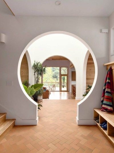 A Keyhole Archway Hides Shoe Cubbies in This Asheville Home’s Front Hallway Archways In Homes, Front Hallway, Shoe Cubby, Entry Way, House Inspo, Cubbies, Built Ins, تصميم داخلي, Future House