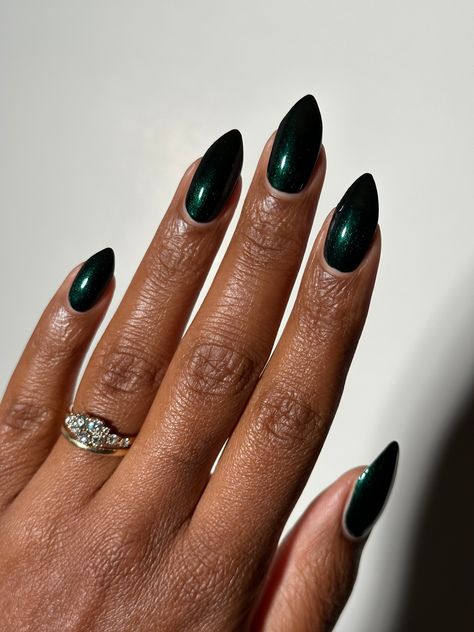 Dark emerald green shimmer 10-free. Vegan. Cruelty-free. Nontoxic. We suggest using a base coat and 2-3 coats of polish followed by a top coat. This polish comes with a removable handmade decorative bronze cap atop our standard black matte nail polish cap - merging artistry with function. To forego bronze caps on your order click here. Swatches by @eviltwinnails @polish.d_ @melly.k.nails @melanted.mani Simple Prom Nails Emerald Green, Deep Emerald Green Nails, Dark Jewel Tone Nails, Dark Shimmer Nails, Wedding Nails Emerald Green, Dark Green Metallic Nails, Dark Emerald Nails, Dark Green Black Nails, Pearl Black Nails