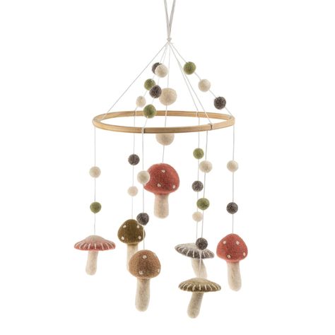 Indulge in sweet dreams with the Toadstool Felt Mobile. Adorable, felted mushrooms and toadstools with earthy coloured caps and white stalks create a soothing atmosphere to lull your little one into a peaceful slumber. This mobile serves as charming decor for both stylish nurseries and fairytale-inspired baby rooms. Made in Nepal Wool & Beechwood Width 8"Height: 20" The Hobbit Nursery Theme, Mushroom Mobile Nursery, Forest Mushroom Nursery, Nursery Ideas Mushroom, Autumn Theme Nursery, Nature Inspired Nursery Ideas, Frog And Toad Nursery Theme, Nursery Ideas Fairytale, Simple Woodland Nursery