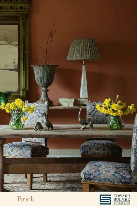 A rustic spring dining room scenes with an eclectic collection of antique pieces from @lorfordsantiq The walls are painted in our shade 'Brick' which is a wonderfully warm earthy hue similar to the natural materials of clay and terracotta. We have been firing clay to make bricks for a very long time and we are used to seeing them mellowed with age. ⁠ To find out how to decorate with on trend earthy colours like this one, visit our blog - link attached. Terracotta Dining Room, Firing Clay, Spring Dining Room, Edward Bulmer, Natural Paint, Earthy Colours, Mood Colors, Eco Friendly Paint, Fire Clay