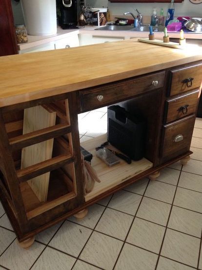 after spending countless hours surfing the web for the perfect kitchen island with a very small budget, left me with very little to choose from. So I decided to make my own and off I went to hit all the second hand stores. SCORE!! Found an old solid wood desk and also butcher block table top. Purchased both for $70. Removed the top of the desk and moved it to the bottom for a platform for the island, attached the butcher block top and added bun feet to bring the island to counte… Faux Brick Backsplash, Faux Brick Panels, Unique Kitchen Design, Deco Champetre, Rustic Kitchen Island, The Perfect Kitchen, Diy Kitchen Island, Perfect Kitchen, Small Budget