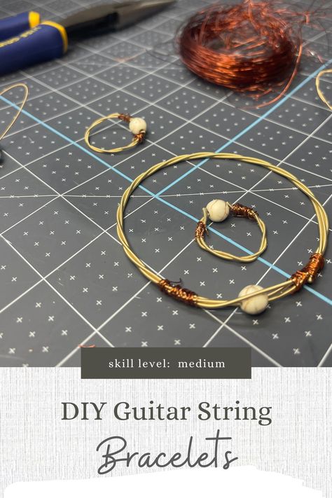 If you have an avid guitar player in your family, then you probably have watched them change the strings fairly often. You can purchase bracelets online, but have you ever thought of making your own? Here are some tips for those of you ready for this crafty upcycle project. Crafts With Guitar Strings, What Are The Strings On A Guitar, Strings On A Guitar, Diy Guitar String Bracelet, Guitar Pick Jewelry Diy, Guitar Crafts, Guitar String Bracelet, String Earrings, Mountain Dulcimer