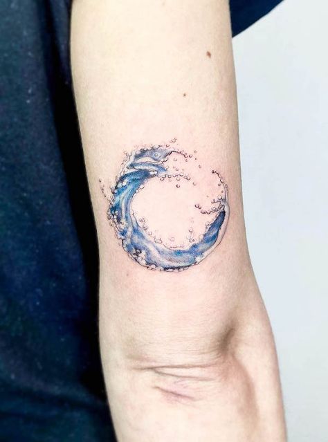 56 Elegant Water Tattoos With Meaning - Our Mindful Life Water Cover Up Tattoo, Water Line Tattoo Ideas, Wave Anchor Tattoo, Watercolour Tattoos For Women Small, American Traditional Water Tattoo, Black And White Water Tattoo, Water Circle Tattoo, Watercolour Wave Tattoo, Whitewater Tattoo