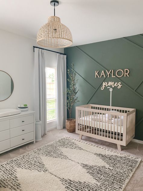 Green White And Wood Nursery, Nanit Wall Mount Nursery, Sage Green Nursery Gender Neutral Accent Wall, Neutral Nursery Minimalist, Hunter Green Accent Wall Nursery, Modern Green Nursery, Accent Walls For Nursery, Nursery Ideas Olive Green, Nursery Ideas Green Walls