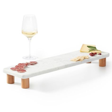 Elevated for gorgeous charcuterie displays. This cheeseboard is Fair Trade Certified(TM) and handcrafted from marble with acacia wood feet. Marble Kitchen Aesthetic, Marble Decorative Items, Granite Furniture, Marble Diy, Charcuterie Display, Marble Serving Boards, Spa Food, Marble Cheese Board, Poolside Cabana