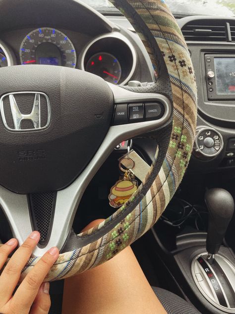 First Car Interior, Cool Steering Wheel Covers, Cute Car Interior Ideas Decor, First Car Aesthetic, Car Decor Aesthetic, Steering Wheel Cover Boho, Interior Car Decorations, Car Mirror Decor, Cozy Car