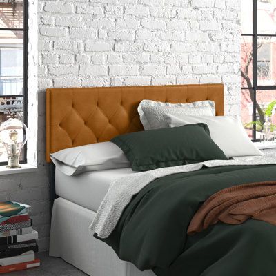 This wall-mounted panel headboard instantly updates your space with a sleek look and easy installation. It's made of solid and engineered wood with legs and a traditional rectangular shape. The faux leather gives it a rustic look, and it's filled with polyester for comfort. We love the button diamond tufting that adds a bit of modern style. This headboard comes with pre-drilled holes and hardware for a simple mounting process. Compatible with adjustable beds. Size: Full, Upholstery: Camel Faux Leather Headboard, Diamond Tufting, Black Headboard, Leather Headboard, Queen Headboard, Upholstered Panels, Tufted Headboard, Bedroom Headboard, Panel Headboard