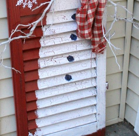 Do you have any old shutters hanging around? I do. I kinda collect them from the side of the road when I find them. This amazing Christmas porch idea is why you should save old shutters! Painted Shutters For Christmas, Christmas Shutter Crafts, Wood Shutter Craft Ideas, Shutter Projects Christmas, Large Shutters Repurposed, Shutter Crafts Ideas Christmas, Painting Snowmen On Wood, Christmas Shutters Diy, What To Do With Old Shutters