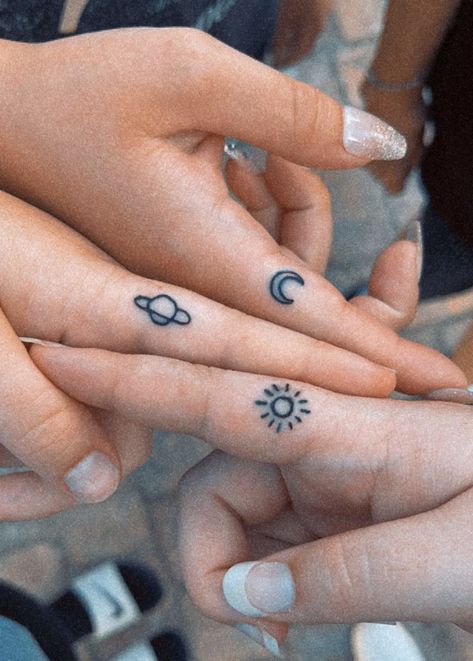 A sun moon and planet finger tattoo Cousin Trio Tattoos, Matching Tattoos For Cousins Small, Tattoo Ideas 3 People, Friendship Tattoo Ideas For 3, Matching Tattoos For 3 Cousins, Four Person Matching Tattoo, Cute Matching Tattoos With Grandma, Tattoo Ideas For A Trio, Cute Mini Matching Tattoos