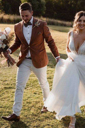 Rustic Groom Attire For Country Weddings ★ rustic groom attire brown jacket with bouttonier and bow tie nathan lapham Groom Attire Brown, Rust Suit Wedding, Bohemian Wedding Groom, Rustic Groom Attire, Groom Attire Rustic, Rust Suit, Rustic Groomsmen Attire, Rustic Wedding Groom, Fall Groom