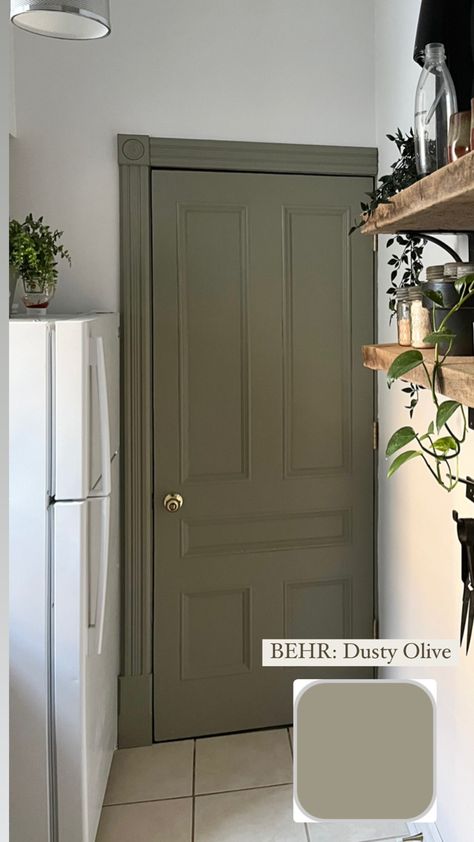 French country small white kitchen with green door and door frame Washed Olive Behr, Green Painted Walls Behr, Olive Green Door Interiors, Behr Witch Hazel, Olive Green Behr Paint, Olive Doors Interior, Olive Front Door Colors, Perfect Olive Green Paint, Green Hallway Doors