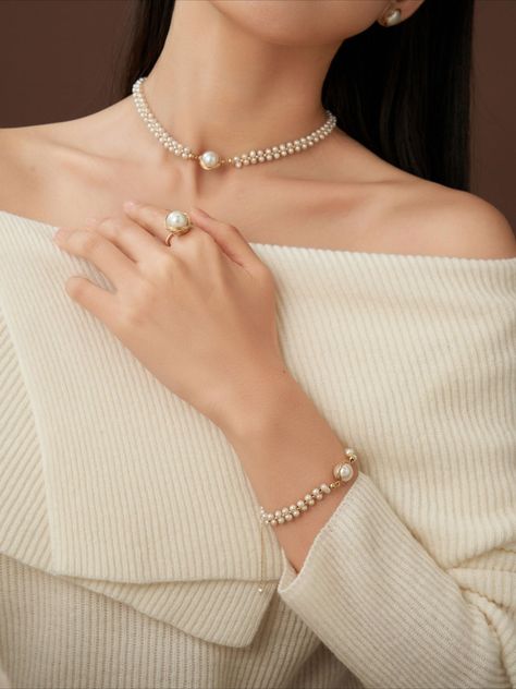 Introducing the COCOKIM Stargazer Choker. Timelessly elegant, it intertwines pearls and gold thread to create an everlasting allure. Fusing vintage charm with modern sophistication, pearls become the language of beauty, composing a poetic rhythm of elegance. Whether paired with professional attire or adding a touch of refinement to casual outings, you can always trust the timeless grace of the Classic Wrapped Series. Metal: 14k Gold Filled Pearl: Freshwater Pearls Chain Length: 350mm + 50mm adju Pearl Choker Bridal, Simple Pearl Choker Necklace Designs, Pearl Choker Wedding, Choker Necklace Designs, Pearl Jewelry Design, Simple Pearl, Gold Designs, Necklace Sets, Pearl Choker Necklace