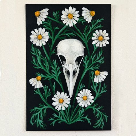 This painting of a Crow skull surrounded by whimsical chamomile flowers is ready to adorn your walls! Original gouache painting on archival black paper. Framed in gold colored metal with chain for hanging. Space between top of frame and top of chain is about 7" but the chain can be adjusted to any length. 4" x 6" Signed and dated on back. Dark Flower Painting, Skull Painting Ideas, Gouache Inspiration, Paint Challenge, Tiny Canvas, Black Canvas Paintings, Crow Skull, Start Painting, A Crow