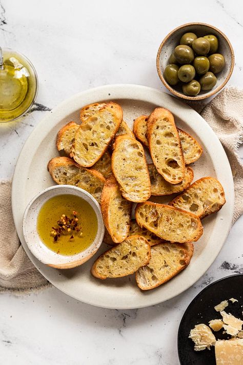 Slices of baguette turn into golden, crispy crostini and are the perfect base for easy, hand-held appetizers. Top crostini with your favorite cheese and flavor combinations, or serve them alongside a dip. There's no wrong way to enjoy these little toasts! Crispy Baguette Slices, Easy Crostini, How To Make Crostini, Crostini Toppings, Crostini Recipe, Crostini Appetizers, Crostini Recipes, Flavor Combinations, Favorite Dips