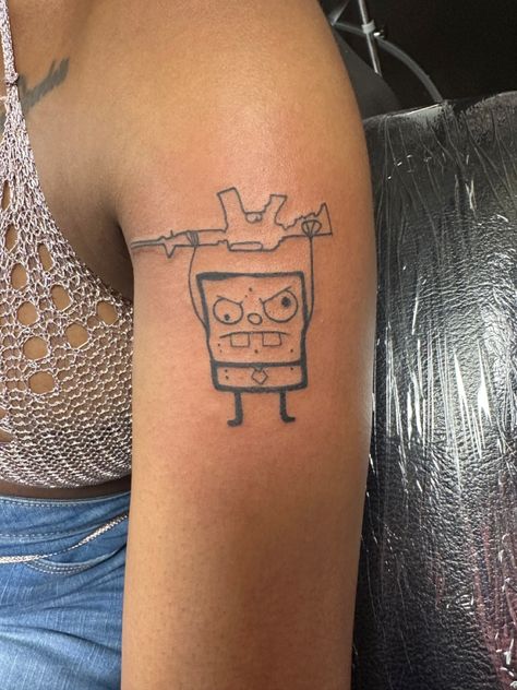 Doodle bob tattoo by Miranda west Funny Men’s Tattoos, Funny Cool Tattoos, Doodle Bob Drawing, Doodle Tattoos For Women, Funny Cartoon Tattoos, Funny Patchwork Tattoos, Sackboy Tattoo, Cool Tattoo Ideas For Men Small, Tattoo Ideas Cartoon Characters