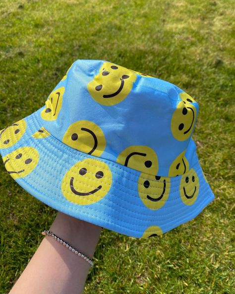 Bucket hats and clothing. on Instagram: “🙃Blue smiley face bucket hat. 😀£13!!” Smiley Face Clothing, Blue Smiley Face, Bucket Hat Outfit, Happy Photos, Face Aesthetic, 14th Birthday, Smiley Faces, Face Cloth, Outfits With Hats