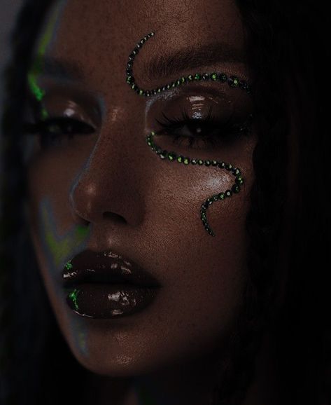 dark lipstick, black girl, green snake rhinestones, eyebrows, clear skin, lashes, brown eyes Dark Green Sparkly Makeup, Dark Rhinestone Makeup, Green Sparkly Eye Makeup, Alien Makeup Green, Dark Festival Makeup, Black Rave Makeup, Green Rhinestone Makeup, Black Rhinestone Makeup, Techno Party Makeup