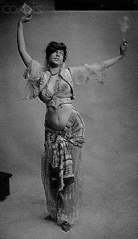 IH169634 | 1900 --- Belly Dancer Holding up Package of Cigar… | Flickr Des Femmes D Gitanes, Rachel Brice, Vintage Burlesque, Vintage Dance, Shotting Photo, Belly Dancer, Belly Dance Costumes, Foto Vintage, Belly Dancers