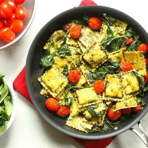 Pesto Ravioli with Spinach & Tomatoes Recipe - EatingWell Pesto Ravioli, Spinach Ravioli, Pastas Recipes, Kitchen Staples, 5 Ingredient Dinners, Easy Vegetarian Dinner, Pantry Ingredients, Tomatoes Recipe, Vegan Pesto