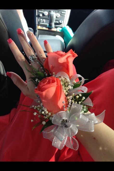 Coral rose corsage Coral • silver • ribbon • bracelet • nails • James Avery • ring • coral nails • Coral Roses Bouquet, Coral Corsage, Bracelet Nails, Corsage Wedding Mother, Rose Gold Moissanite Engagement Ring, Prom Flowers Corsage, Prom Corsages, Prom Corsage And Boutonniere, Gold Moissanite Engagement Ring