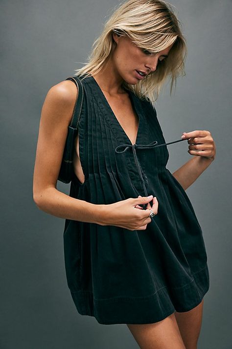 Totally timeless in a relaxed, ready-for-anything design, this staple romper is featured in a soft, denim-inspired design with pleating throughout and tie detail at front for added dimension. **Fit:** Relaxed, drapey design **Features:** V-neckline, tie detail at neckline, pleating throughout, side pockets **Why We | Webster Romper by Free People in Black, Size: S Free People Webster Romper, Outfits For Hot Days, Concert Outfit Fall, Dresses Sundresses, Rockstar Aesthetic, Free People Romper, Free People Clothing, Denim Mini Dress, Going Out Outfits