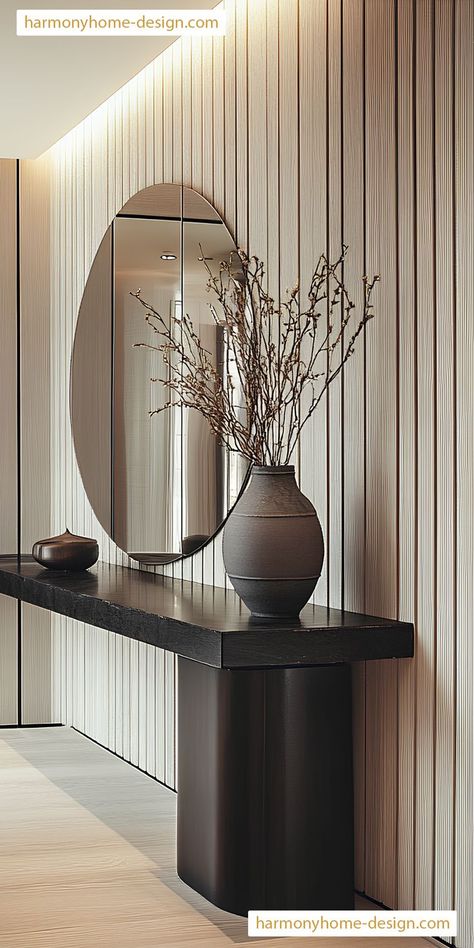 A stylish hallway integrates a console table with minimalist decor for a clean look. Greige Hallway, Minimalist Console Table, Clean Look, Accent Lighting, Architectural Features, Minimalist Decor, Console Table, Hallway, Highlights