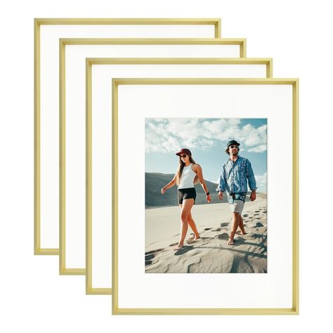 PRICES MAY VARY. WORK WITH 8X10 OR 5X7 PICTURES: With one 4.5x6.5 opening ivory white mat, this 8 by 10 picture frame is able to display 5x7 photo with ivory mat or 8x10 prints without mat. Design the gallery wall at home easily and freely. Flexible swivel tabs on the back enable you to switch photos in and out effortlessly, easy to use. ELEGANT YET STURDY PICTURE FRAME: No flimsiness! Compared with plastic frames, our 8x10 gold frame is made of premium aluminum alloy, lightweight, sturdy and lo Gold And White Pictures, Metal Photo Frame, Mat Design, Gold Picture Frame, 8x10 Prints, Metal Photo Frames, Home Office Living Room, Landscape Portrait, Photo Matting