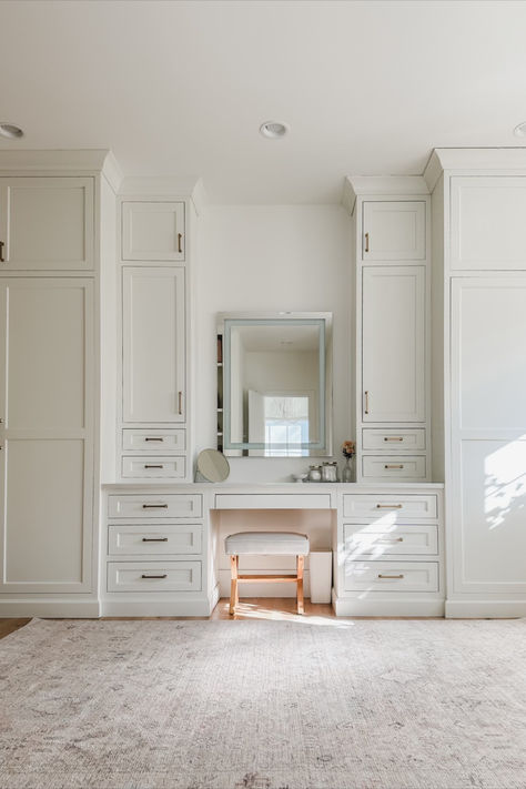 Primary bedroom closet with built in vanity details featuring creamy whites, natural wood tones, and gold detail. Loving this vintage inspired Becki Owens rug to warm up the space Home organization, spring refresh, home finds, primary bedroom closet, vanity stool, designer closet, gold detail, creamy whites, warm woods, vintage inspired rug, Becki Owens, vanity mirror, Amazon Prime, found it on Amazon, Target, light and bright, aesthetic closet, organized home