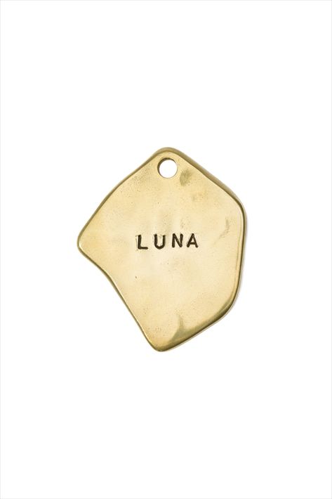 Our unique dog tags are perfect for pups, or a great way to easily identify your luggage. Made in Japan and designed in the USA in collaboration with Blink. This pet tag can be personalized with your pet's name and 1 or 2 phone numbers. Or you could prrrchase it without personalization and wear it as a charm. Tag size: W 1” x 1.1” (2.6 cm x 2.8 cm). Solid brass. Will change color with time and use. We provide a polishing pad with every order so you can make it sparkle again at any time. #dogtag Alex Proba, Dog Name Tags, Umbrella Designs, Ear Tag, Modern Pet, Dog Ear, Dog Id Tags, Pet Tags, Pet Id