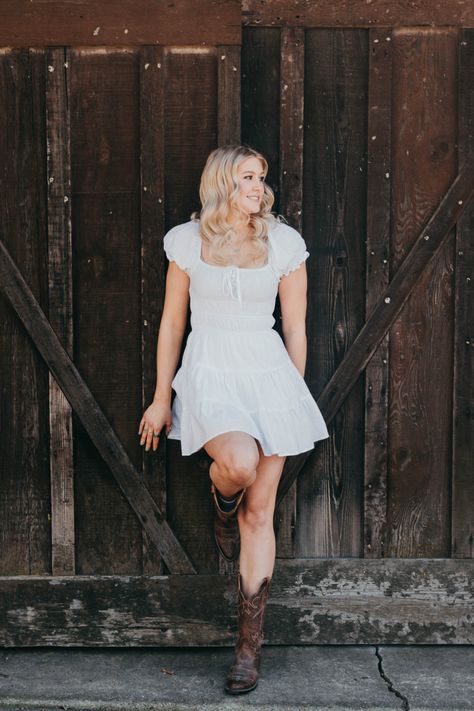 Cowgirl Boot Senior Pictures, Senior Photo White Dress, Senior Pictures In Dress, Senior Pictures Outfits Cowboy Boots, Senior Picture Ideas Cowgirl Boots, Senior Photos With Cows, Farm Senior Picture Ideas, White Dress Senior Pictures, Barn Photoshoot Ideas