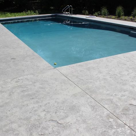 Colored Concrete Pool Deck, Sand Finish Concrete Pool Deck, Concrete Pool Coping Ideas, Poured Concrete Pool Deck, Textured Concrete Pool Deck, Pool Concrete Colors, Pool Decking Options, Salt Finish Concrete Pool Deck, Pool Decking Ideas Inground