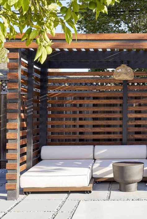 Pool cabanas are a welcome addition to any backyard, offering a shaded lounge space tailored to your lifestyle. Here are some cool and stylish pool cabana ideas. #outdoordecor #poolcabanas #patiodecor #shadebackyard #apartmentliving #smallspacedecorating #thespruce Outdoor Cabana Lounge, Poolside Deck Ideas, Patio Cabana Ideas, Backyard Daybed Ideas, Pool Outhouse Ideas, Backyard Sunbathing Area, Poolside Shade Ideas, Pool Side Pergola Ideas, Small Cabana Ideas Backyard