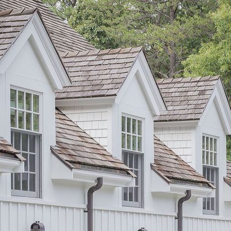 Patrick Ahearn Architect LLC on Instagram: "Centered between operable doors below and gabled dormers above, a trio of artisanal copper lanterns adds an extra layer of character to this suburban Boston carriage house wing. Builder: @sweeneycustomhomes Landscape Architect: @abladeofgrass_inc Photographer: @michaeljleephotography" Dormer Window Above Garage, Garage With Dormers, Dormer Styles, House With Dormers, Karla Sorensen, Gable Dormer, Dormer Ideas, Gambrel House, Dormer House