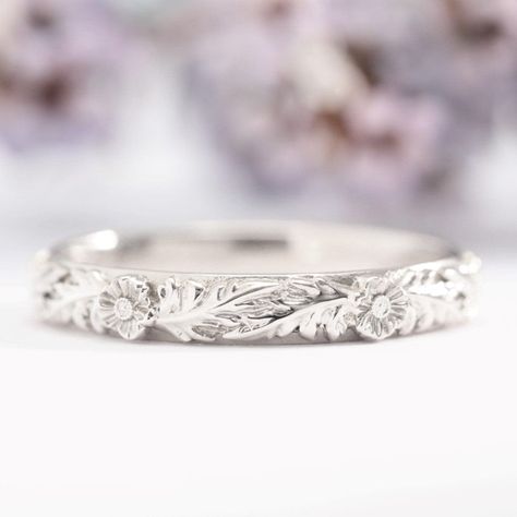 Inspired by nature, this one-of-a-kind ring features two Poppy flowers in an intricate leaf pattern in a gold band. The leaf pattern goes to the halfway point, and is hand engraved with special care and attention, meaning that your nature wedding ring will truly be one of a kind. Each of our pieces is tailor-made and handcrafted with love and care in our workshop, just for you. Please allow up to 3 weeks for us to make it.All pieces come lovingly packaged in our luxurious white jewellery boxes, Natural Wedding Bands For Women, White Gold Band Ring, Leaf Ring Band, Nature Wedding Band, Flower Wedding Band, Nature Inspired Wedding Ring, Nature Wedding Ring, Leaf Wedding Rings, White Jewellery