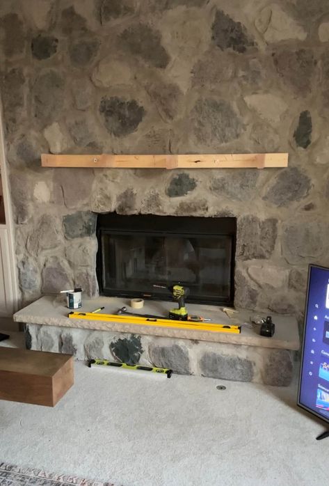 The frame for the mantle mounted above the fireplace. Mounting A Mantle On Brick, Diy Fireplace Surround, Corner Fireplace Mantels, Cover Fireplace, Diy Mantle, Diy Fireplace Mantle, Above The Fireplace, Wooden Fireplace, Corner Fireplace