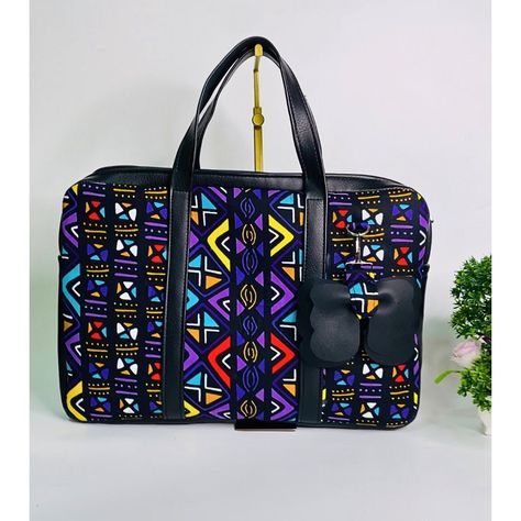 Yes, it's a laptop bag, and yes it's fancy and spiffy. Exactly what you need to give that classic and vibrant work look. Trash that pale-looking laptop bag and get yourself a bag that uplifts your spirit. #ankara #modabellabyfey #ankarafashiondesigner #ankarabags #bellanaijaweddings #bags #laptoplifestyle #laptopbag Graduation Photo Booth, Ankara Bags, Handmade Fabric Bags, Bags Diy, Laptop Lifestyle, Bella Naija Weddings, Graduation Photos, Handmade Fabric, Work Looks